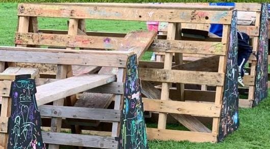 climbing structure built from pallets and boards